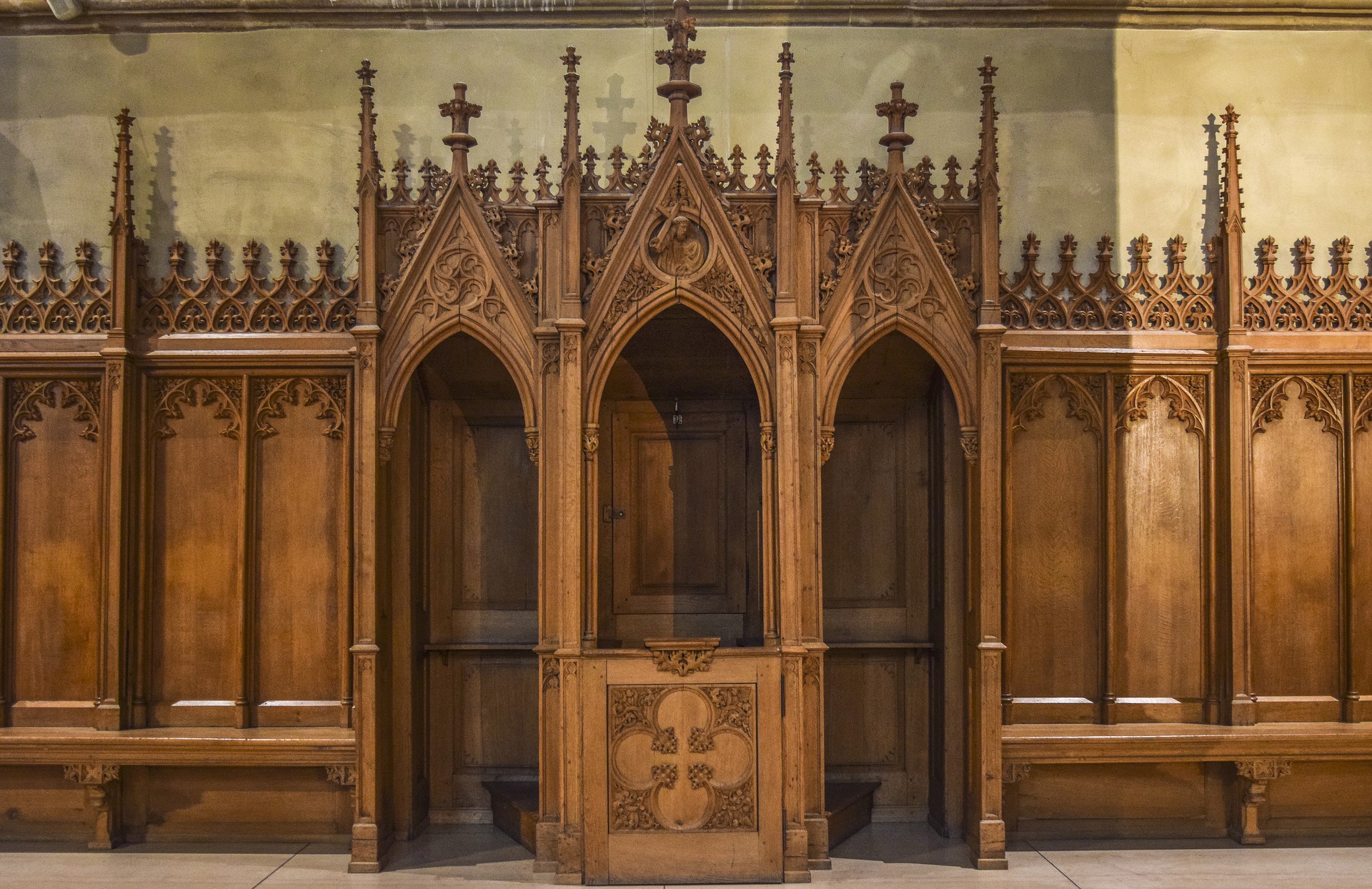 This images displays a wooden confession booth