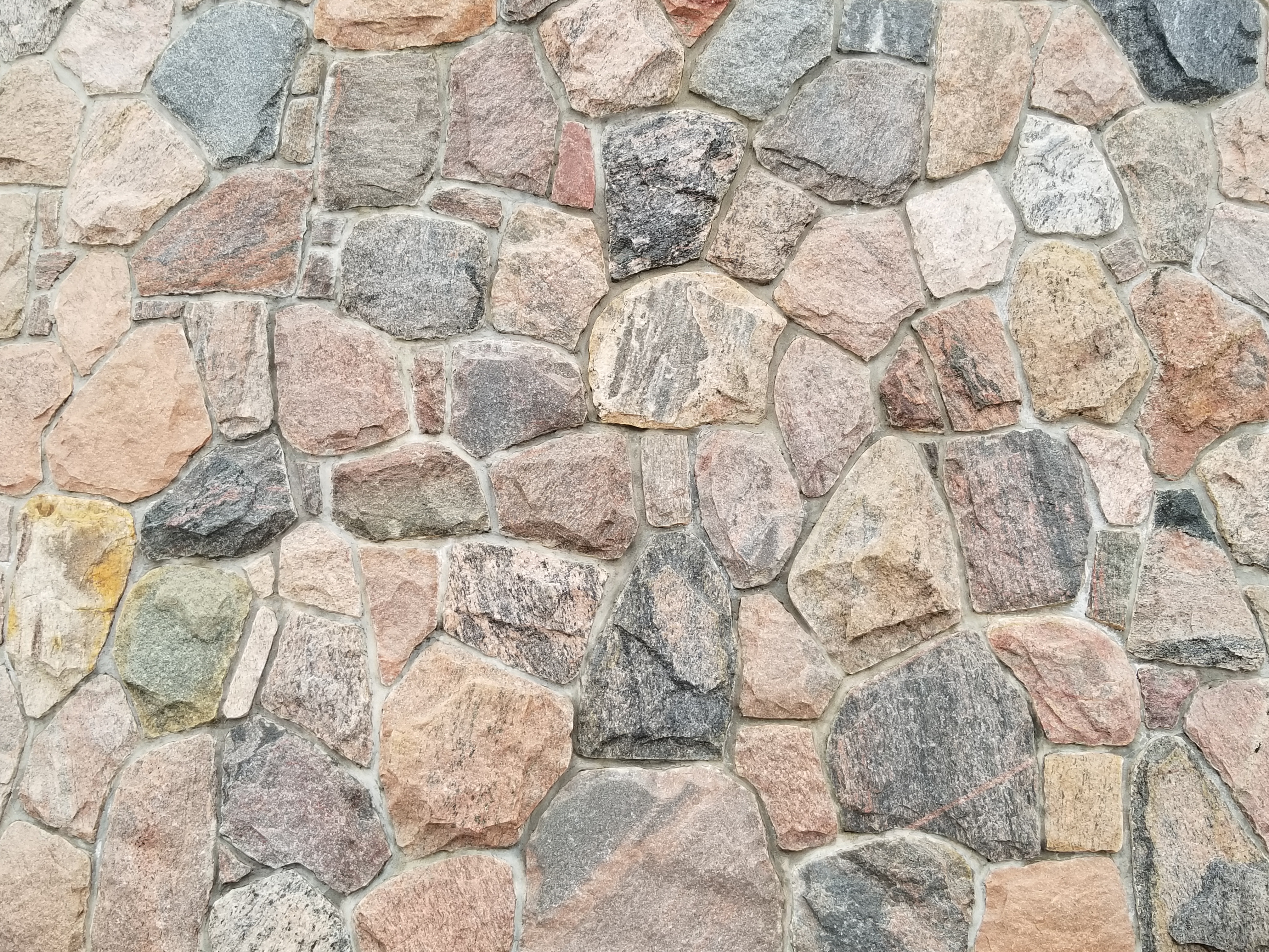 SJV rock wall on the exterior of the building